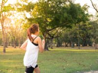 woman about to run during golden hour